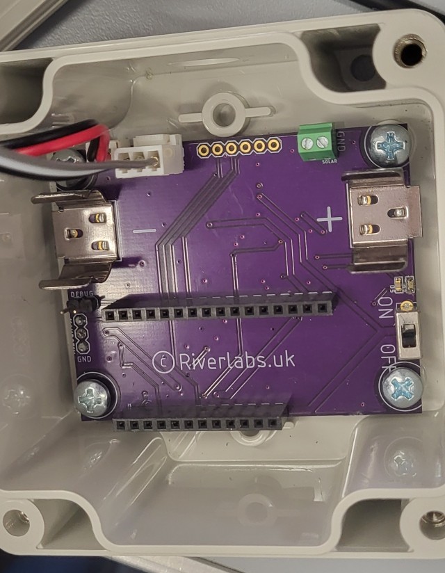 opened up showing the Riverlabs custom PCB